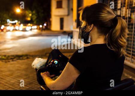 Young woman in electric scooter for disabled Stock Photo