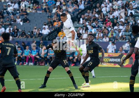 Los Angeles Galaxy forward Javier Hernandez (14) leaps for a header against Los Angeles FC midfielder Daniel Crisostomo (15) during a MLS match, Sunda Stock Photo