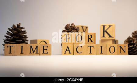 The word Time for Action was created from wooden cubes. close up Stock Photo