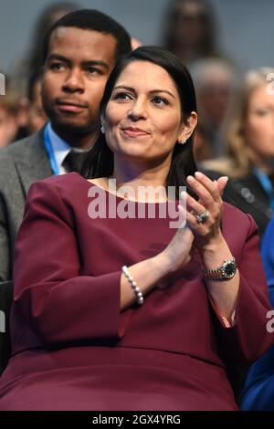 Manchester, UK. 4 October 2021. Home Secretary Priti Patel in the audience as Chancellor of the Exchequer Rishi Sunak addresses the Conservative Party Conference in Manchester. Picture date: Monday October 4, 2021. Photo credit should read: Matt Crossick/Empics/Alamy Live News Stock Photo