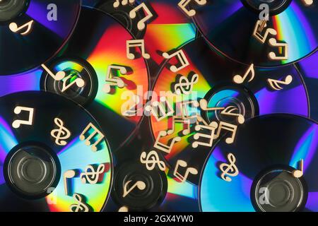 The musical notes lie on the surface of the CD with a refractive effect ...