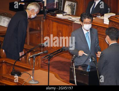 Tokyo, Japan. 04th Oct, 2021. Former Japan's Prime Minister Shinzo Abe (R2) casts his ballot to elect the new Prime Minister at Lower House's plenary session at the National Diet in Tokyo, Japan on Monday, October 4, 2021. Photo by Keizo Mori/UPI Credit: UPI/Alamy Live News