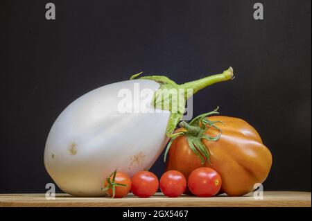 TORINO, ITALY - Sep 07, 2021: A closeup of eggplant and tomatoes. Stock Photo