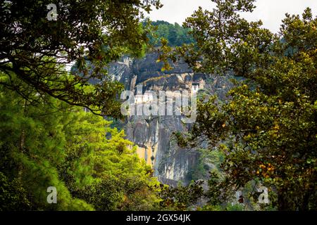 Paro Taktsang, also known as the Taktsang Palphug Monastery and the Tiger's Nest is a sacred Vajrayana Himalayan Buddhist site located in the cliffsid Stock Photo