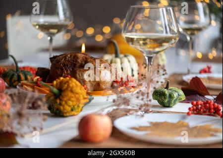 Traditional festive dinner with delicious roasted turkey served on table Stock Photo