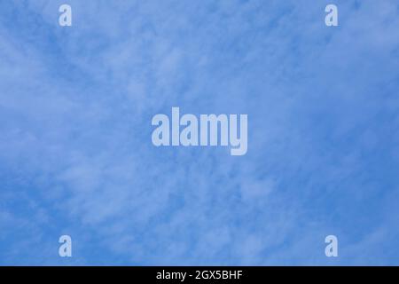 background of blue autumn sky with small white clouds Stock Photo