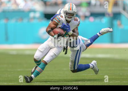 Miami Dolphins running back Salvon Ahmed (26) breaks the tackle of Raiders  defensive tackle Mau …