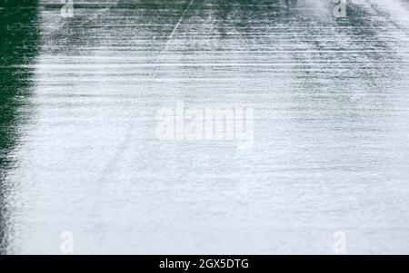 wet asphalt city road after rain with sky reflections. rainy weather in the city Stock Photo
