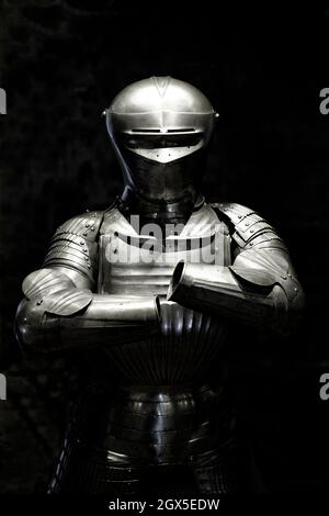 suit of armour on black background Stock Photo