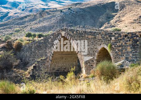 The Ponte dei Saraceni (Bridge of the Saracens) over the Simeto river, near Adrano, Sicily. Dating from the 11c, it has been rebuilt several times Stock Photo