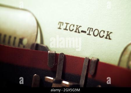 Tick tock text written with a typewriter. Stock Photo