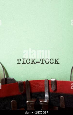 Tick tock text written with a typewriter. Stock Photo