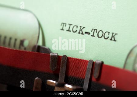 Tick tock text written with a typewriter. Stock Photo