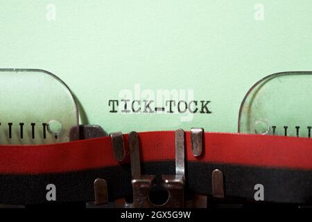 Tick tock text written with a typewriter. Stock Photo