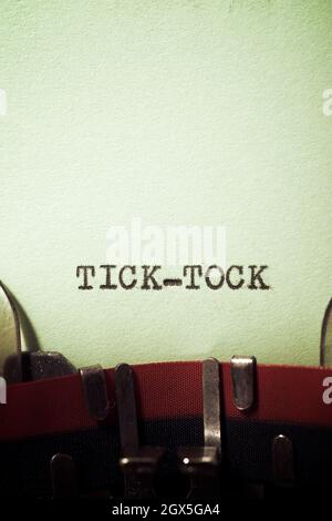 Tick tock text written with a typewriter. Stock Photo