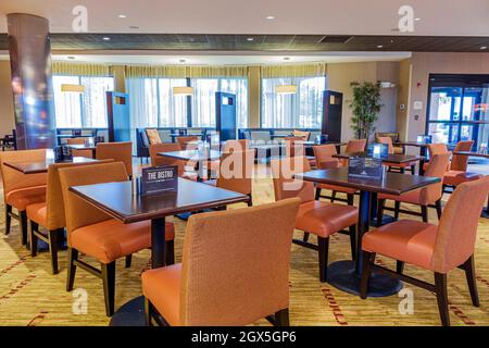Stuart Florida,Courtyard by Marriott,hotel interior inside lobby,breakfast empty dining room tables chairs restaurant The Bistro Stock Photo
