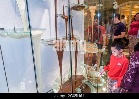 Las Vegas Nevada,The Strip Bellagio hotel casino,Jean-Philippe Patisserie,world's tallest largest chocolate fountain Asian boy child looking watching Stock Photo