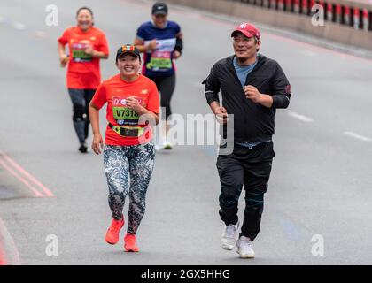 Ariunjargal Erdenetsogt racing in the Virtual Virgin Money London Marathon 2021, in Tower Hill, London, UK, running on the route before the race start Stock Photo