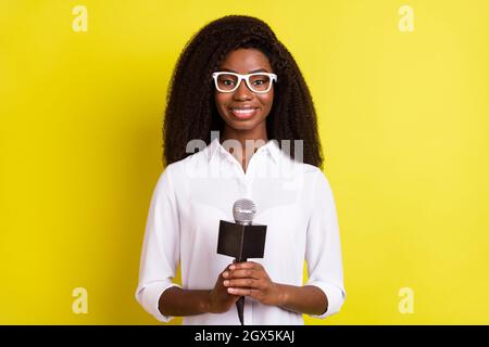 Photo of pretty adorable dark skin lady wear white shirt glasses having breaking news isolated yellow color background Stock Photo