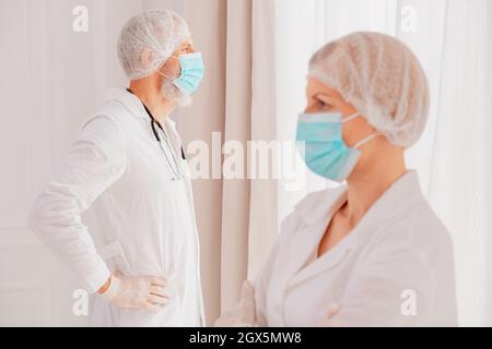 doctors with face mask think are ready to work Stock Photo