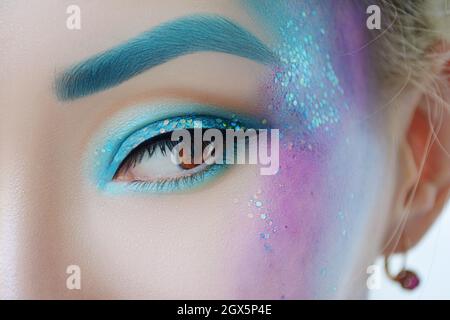 Fantasy mermaid blue glittery makeup Stock Photo