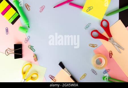 Different stationery on multicolored colorful background, flat lay with space for text. Back to school. Space for text Stock Photo