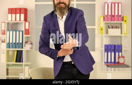 Nice to meet you. Thank you. Welcome. Take a sit. Hello gesture. Lend a hand. Hospitable people. Good manners. Extend hand in welcome gesture. Smart Stock Photo