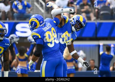 Los Angeles Rams defensive end Aaron Donald (99) and outside linebacker Leonard Floyd (54) celebrate during an NFL football game against the Arizona C Stock Photo