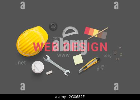 Web design text surrounded with construction tools. Concept flat lay composition Stock Photo