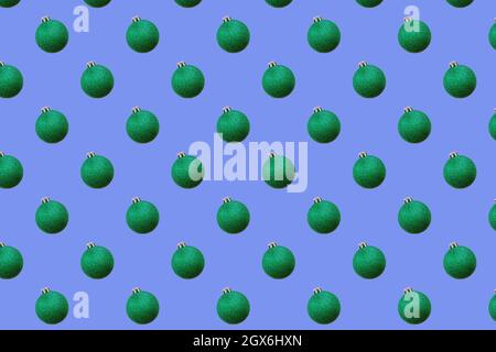 Green Christmas ball seamless pattern on light blue background Stock Photo