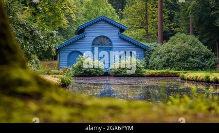 This photo was taken in the royal park of 't Loo Palace near Apeldoorn in the Netherlands. This is a Boathouse that was used by three generations of q Stock Photo