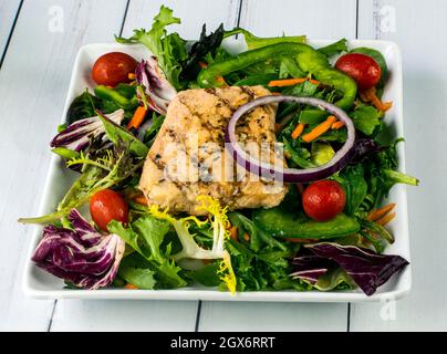 grilled salmon on a mixed green salad Stock Photo