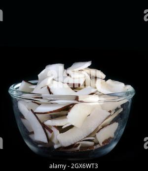 Coconut pieces in Glass bowl. Stock Photo