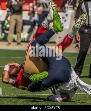 Seattle Seahawks' Jordyn Brooks (56) is tackled by New Orleans Saints'  Lil'Jordan Humphrey after recovering a Saints fumble during the second half  of an NFL football game, Monday, Oct. 25, 2021, in