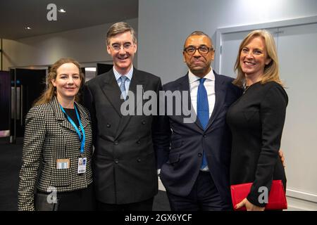 Manchester, England, UK. 4th Oct, 2021. PICTURED: (L-R) Jacob Rees-Mogg wife - Helena de Chair; Rt Hon Jacob Rees-MoggMP; Rt Hon James Cleverly MP Minister for Middle East and North Africa at the Foreign, Commonwealth & Development Office (FCDO); James Cleverly wife - Susannah Janet Temple Sparks. Scenes during the evening after the main speeches at the Conservative party Conference #CPC21. Credit: Colin Fisher/Alamy Live News Stock Photo
