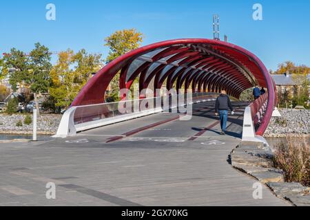 Calgary, Alberta, Canada - 27 September 2021: A view of the Peace Bridge (designed by Santiago Calatrava) in the Autumn season Stock Photo