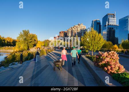 Calgary, Alberta, Canada - 27 September 2021:  People walking on Bow River pathway in the Autumn season Stock Photo