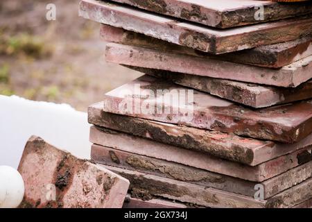 Old broken stone paving slabs. Repair of the sidewalk in city. Stock Photo