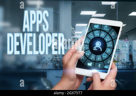 Text sign showing Apps Developer. Word for Graphic artist Software Programmer and Analyst Experts Woman Pointing The Top Screen Of Tablet Showing Stock Photo