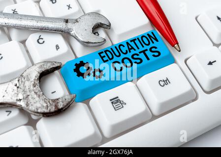 Handwriting text Education Costs. Business showcase amounts paid for tuition fees and other related expenses Typing Engineering Lessons And Lectures Stock Photo