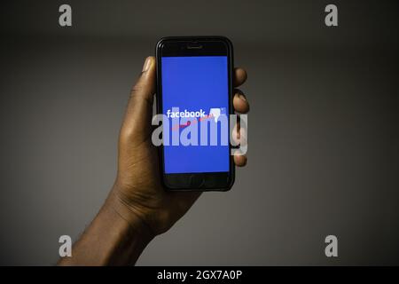 Smartphone with the Facebook logo and the phrase: "Server is down". Facebook is having problems and is not working Stock Photo