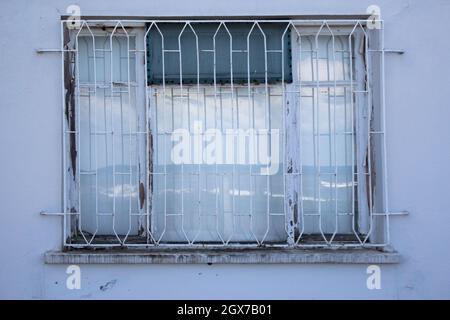 Window with fence to prevent burglary. Stealing is a huge problem in third world countries. Stock Photo
