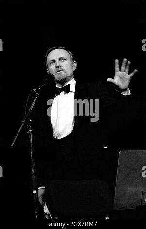 Richard Stilgoe, OBE, English songwriter, lyricist and musician, presenting the Schools Prom at the Royal Albert Hall, London, in 1987.