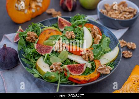 Autumn pumpkin salad and figs, pears and walnuts Stock Photo
