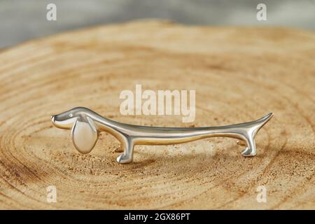 Dachshund shaped cutlery holder made of silver Stock Photo