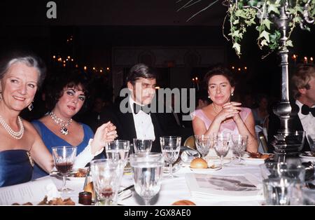 Princess Margaret with Elizabeth Taylor, husband John Warner and friends in a New York restaurant in 1969. Photo: Anwar Hussein  Stock Photo