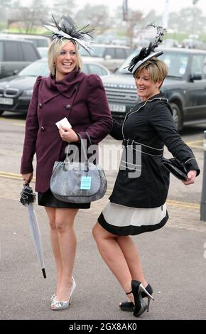 Racegoers attends Ladies Day at the Cheltenham Festival on March 16, 2011. Stock Photo