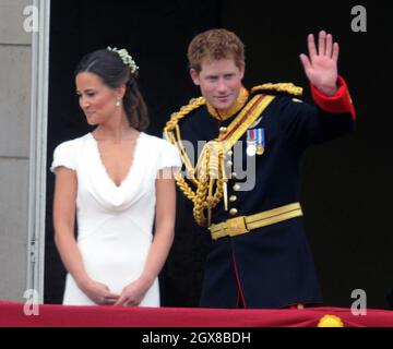 Prince Harry and Pippa Middleton stand on the balcony of Buckingham Palace following the wedding Prince William and Catherine Middleton on April 29, 2011. Stock Photo