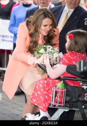 Catherine, Duchess of Cambridge receives flowers from hospice patient Sally Evans as she visits Naomi House Children's Hospice near Winchester. Stock Photo