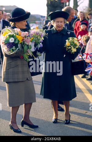 Queen Elizabeth II receives flowers during her visit to Royal Surrey County Hospital in Surrey Stock Photo